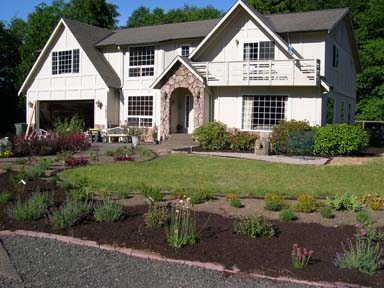 New planting bed reduces size of the lawn.